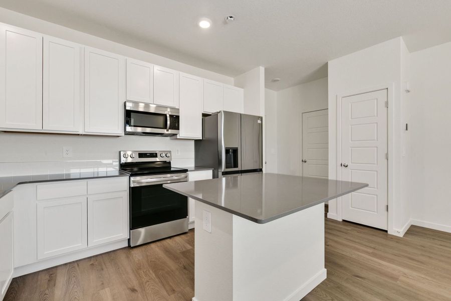 Representative furnished interior of a home built from the Pinecliffe by Baessler Homes in Liberty Draw, Evans (Image 9).
