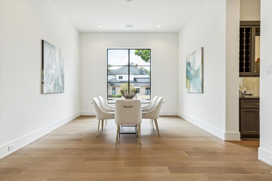 Formal Dining room with gorgeous RAM window has access to entertaining bar and service area.