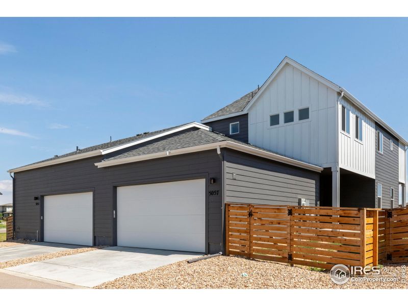 Front exterior of a new home in Trailside on Harmony, Timnath, CO, highlighting curb appeal (Image 15).