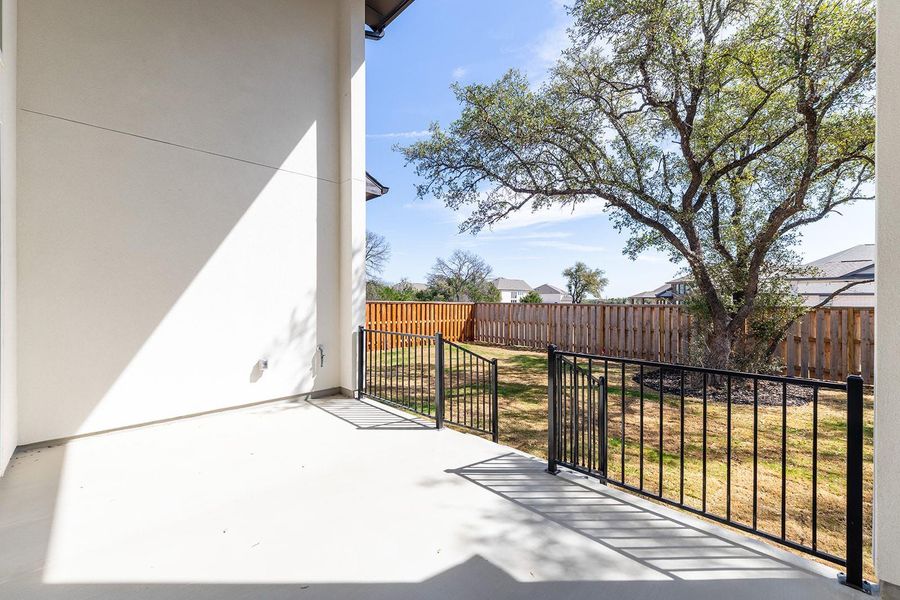 Exterior details and patio area of a home in Parmer Ranch 60, Georgetown (Image 3).
