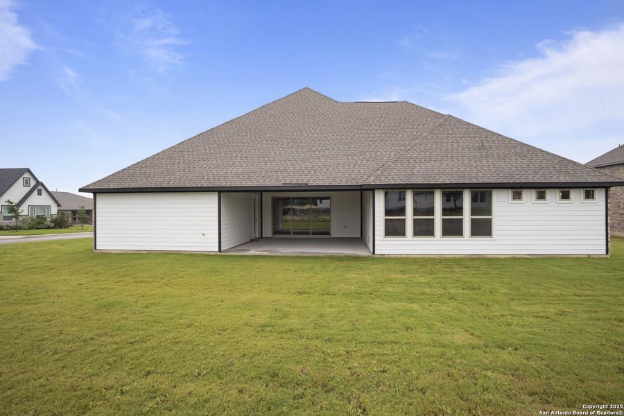 Front exterior of a new home in Potranco Oaks, Castroville, TX, highlighting curb appeal (Image 33).