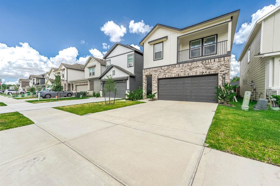 Beautiful front elevation of this single family home with double-wide driveway. Beautiful front elevation of this single family home with double-wide driveway.