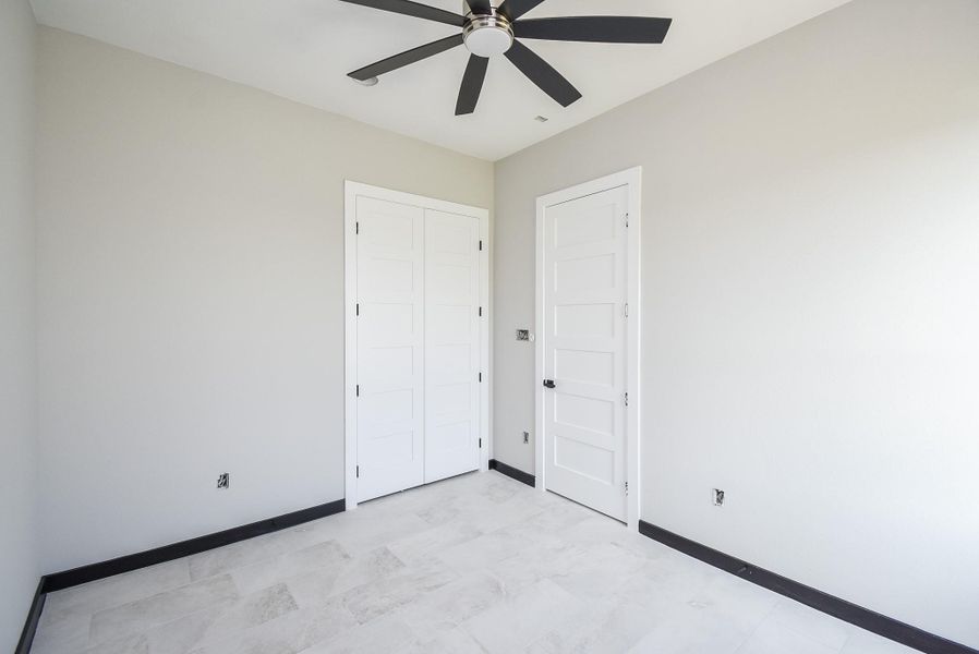 Bedrooms are spacious with ceiling fans. Bedrooms are spacious with ceiling fans.