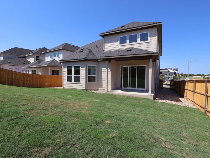 Front exterior of a new home in Cedar Brook, Leander, TX, highlighting curb appeal (Image 2).