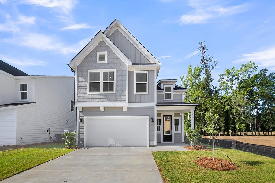 Front exterior of a new home in Pineland Preserve, Summerville, SC, highlighting curb appeal (Image 1). Front exterior of a new home in Pineland Preserve, Summerville, SC, highlighting curb appeal (Image 1).