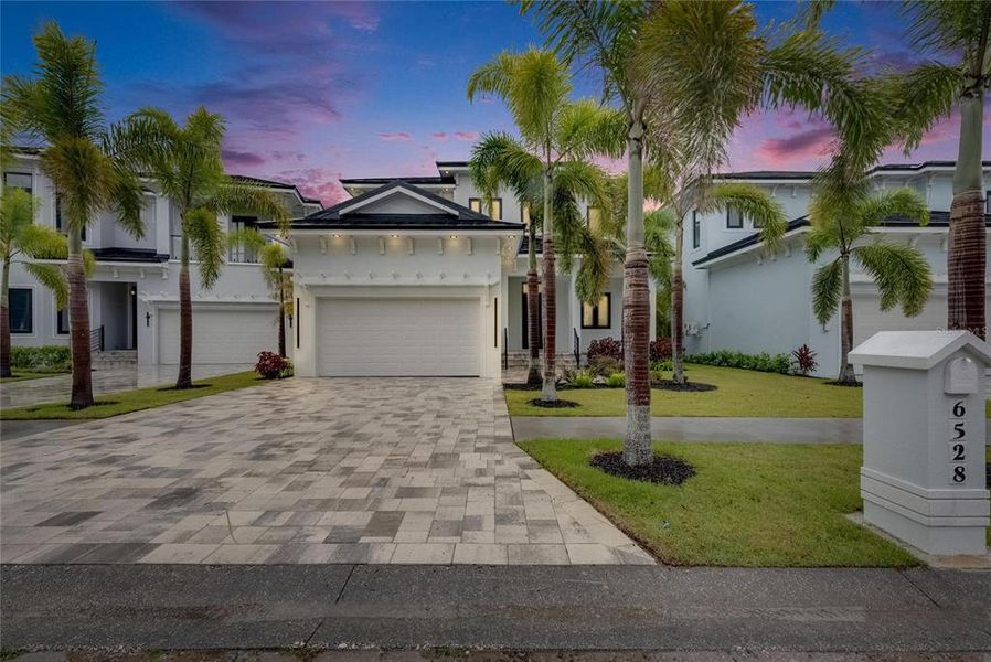 Front exterior of a new home in , Apollo Beach, FL, highlighting curb appeal (Image 1).