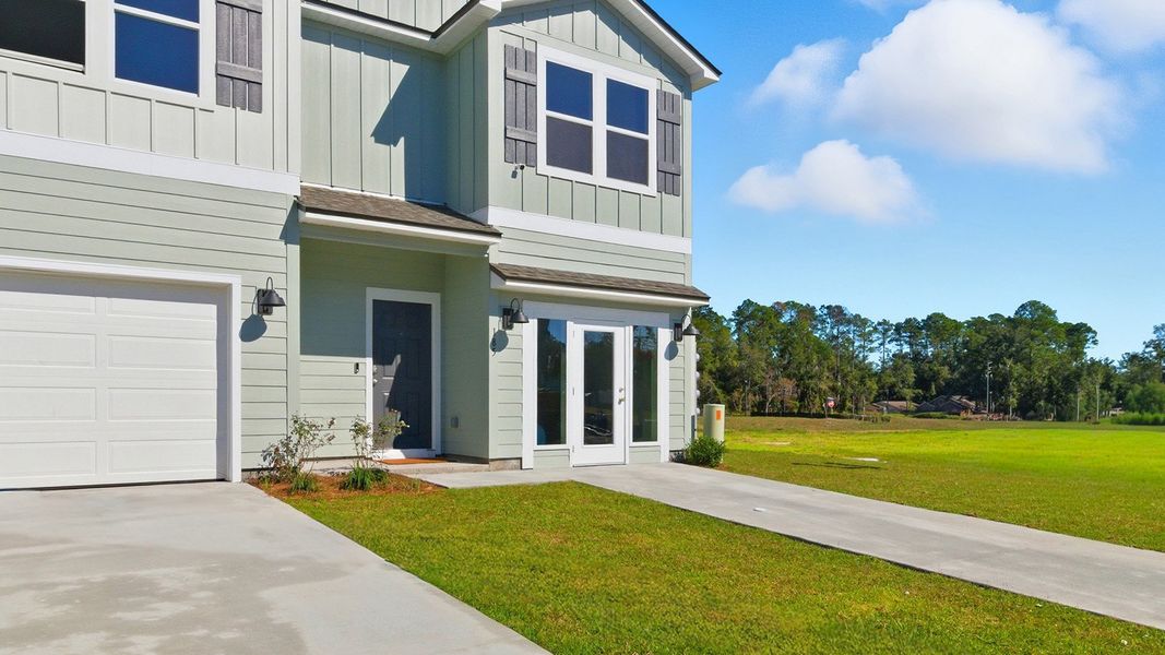 Front exterior of a new home in Revelry, Tallahassee, FL, highlighting curb appeal (Image 28). Front exterior of a new home in Revelry, Tallahassee, FL, highlighting curb appeal (Image 28).