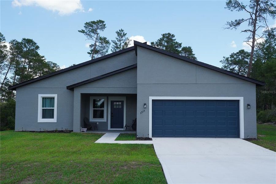 Front exterior of a new home in , Ocala, FL, highlighting curb appeal (Image 30).