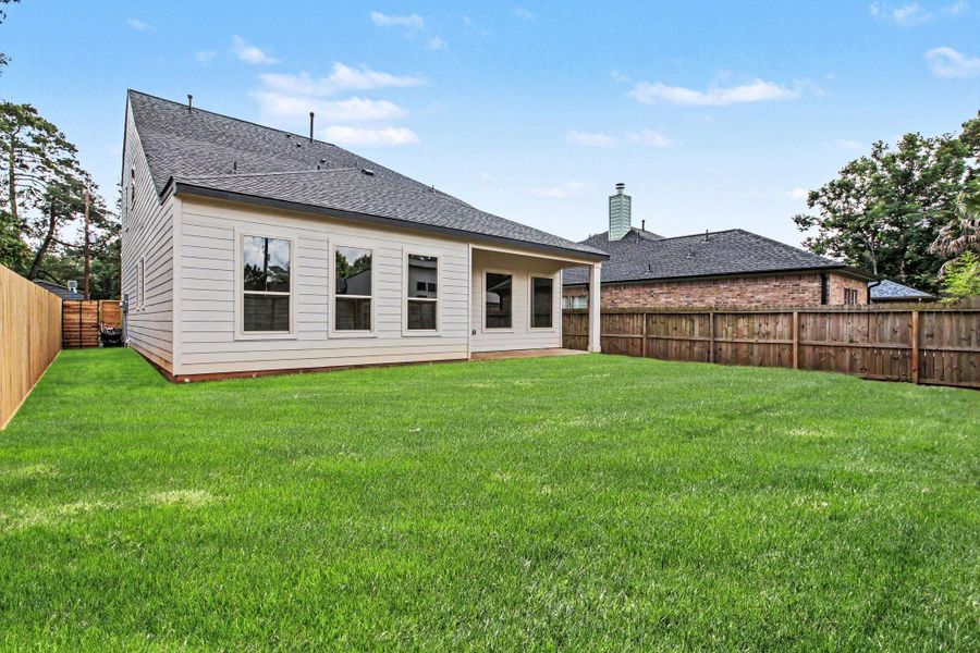 Exterior details and patio area of a home in , Conroe (Image 26).