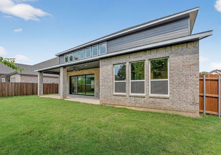 Front exterior of a new home in Legacy Estates, Mansfield, TX, highlighting curb appeal (Image 2). Front exterior of a new home in Legacy Estates, Mansfield, TX, highlighting curb appeal (Image 2).