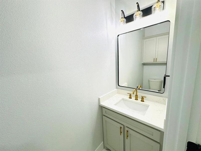 Bathroom with vanity and toilet