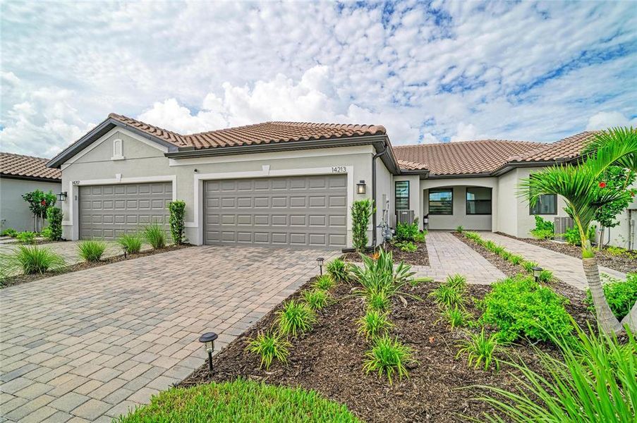 Front exterior of a new home in , Nokomis, FL, highlighting curb appeal (Image 2). Front exterior of a new home in , Nokomis, FL, highlighting curb appeal (Image 2).