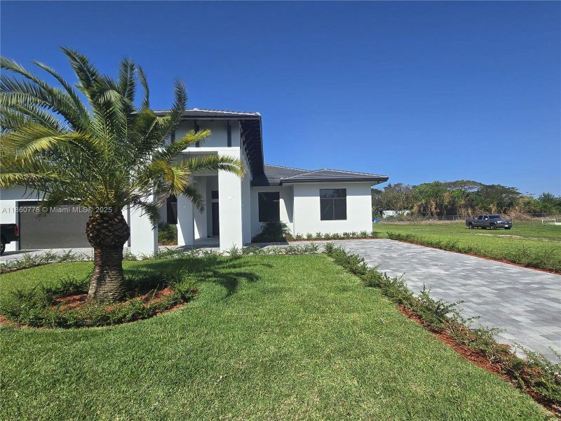 Front exterior of a new home in , Homestead, FL, highlighting curb appeal (Image 31).