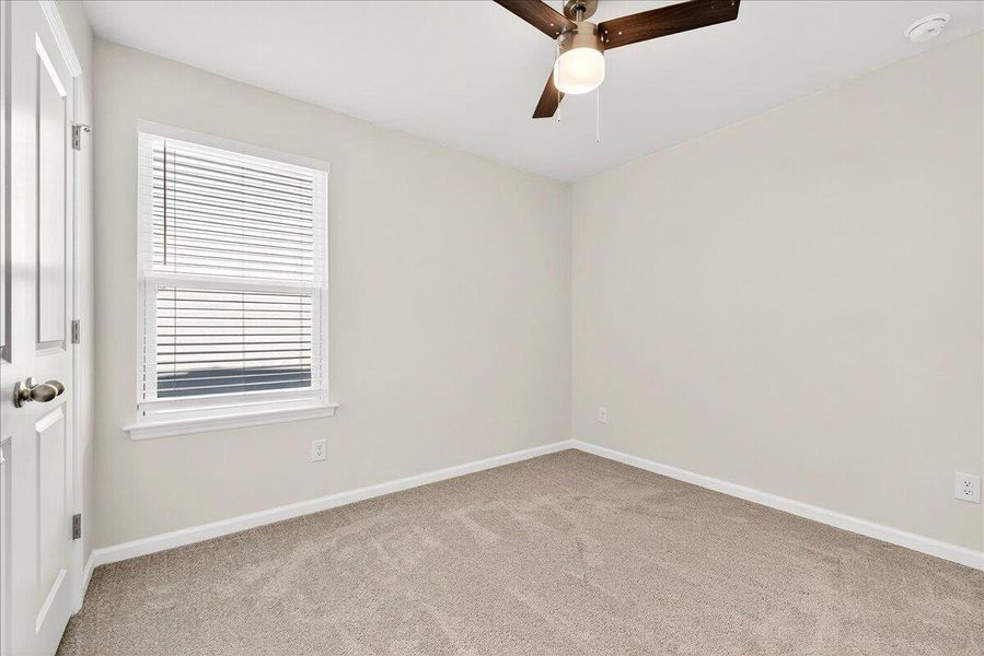 Spacious, unfurnished interior of a new home in Jasmine Point at Lakes of Cane Bay, Summerville (Image 22).