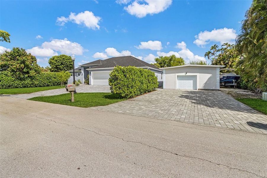 Front exterior of a new home in , Fort Myers, FL, highlighting curb appeal (Image 23). Front exterior of a new home in , Fort Myers, FL, highlighting curb appeal (Image 23).