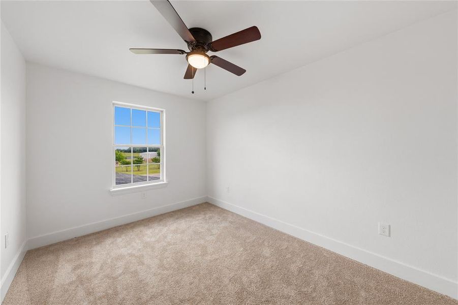 Neutral color palette featuring light beige carpet and white walls
