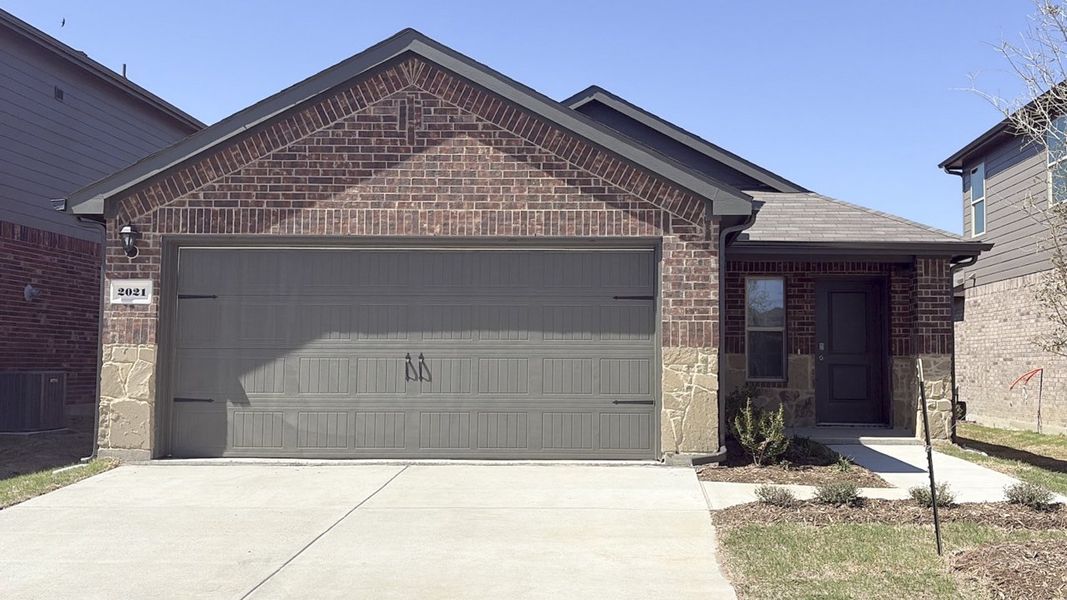 Front exterior of a new home in Wildcat Ranch, Crandall, TX, highlighting curb appeal (Image 1). Front exterior of a new home in Wildcat Ranch, Crandall, TX, highlighting curb appeal (Image 1).