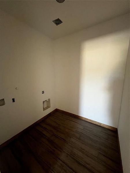 spacious laundry room that allows plenty of space for chores!