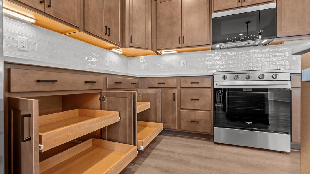 Exclusive kitchen design with large island, pendant lights, and tasteful finishes throughout