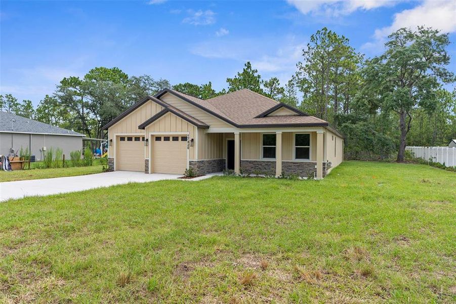 Front exterior of a new home in , Weeki Wachee, FL, highlighting curb appeal (Image 25). Front exterior of a new home in , Weeki Wachee, FL, highlighting curb appeal (Image 25).