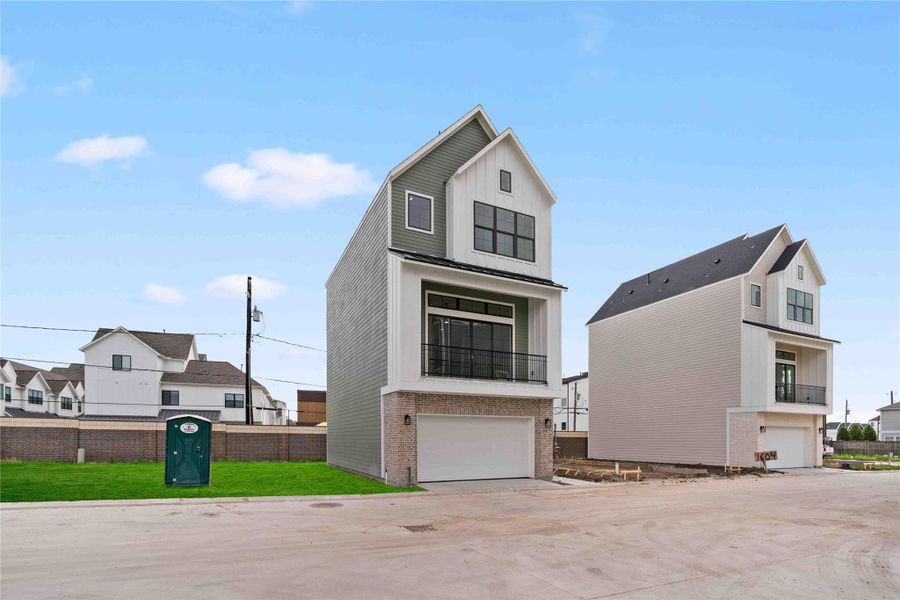 Front exterior of a new home in , Houston, TX, highlighting curb appeal (Image 23).