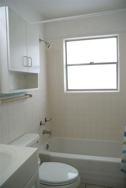 Bright natural light comes in to the bathroom.