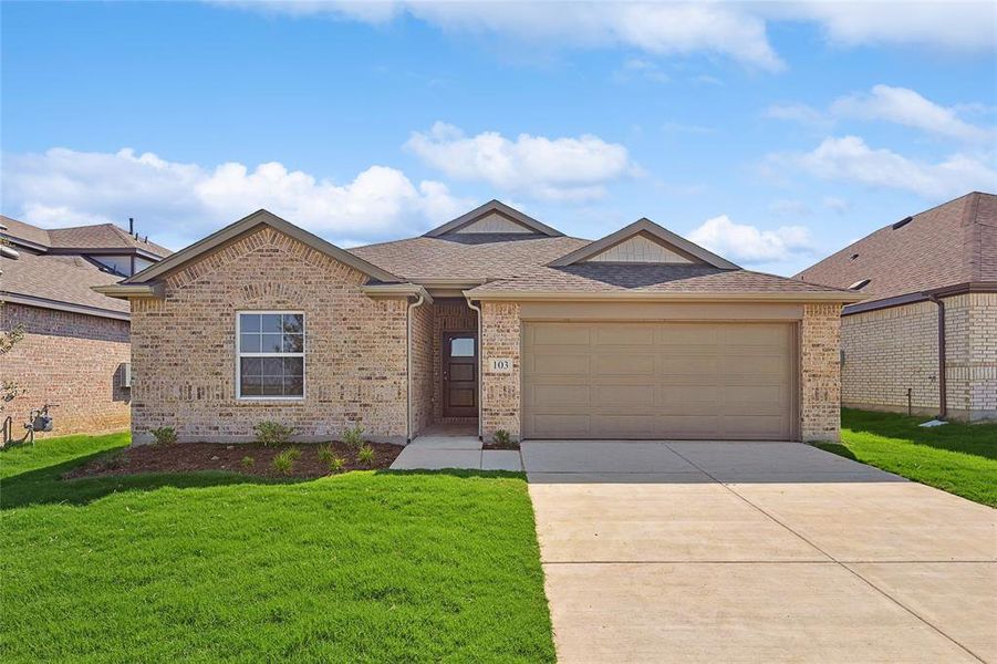 View of front of home with a garage and a front yard