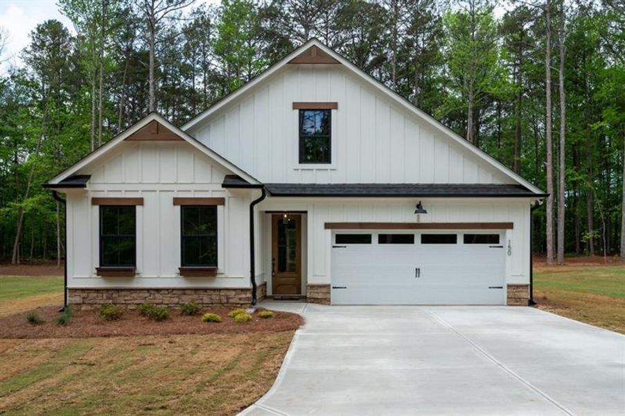 Front exterior of a new home in , Dallas, GA, highlighting curb appeal (Image 23).