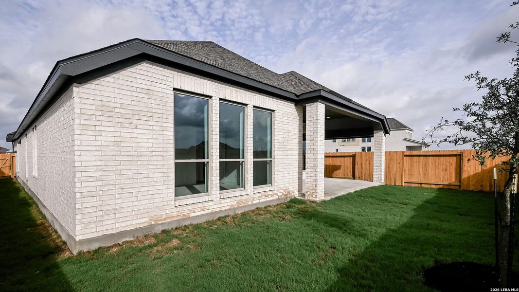Exterior details and patio area of a home in Meadows of Mill Creek, Seguin (Image 4).