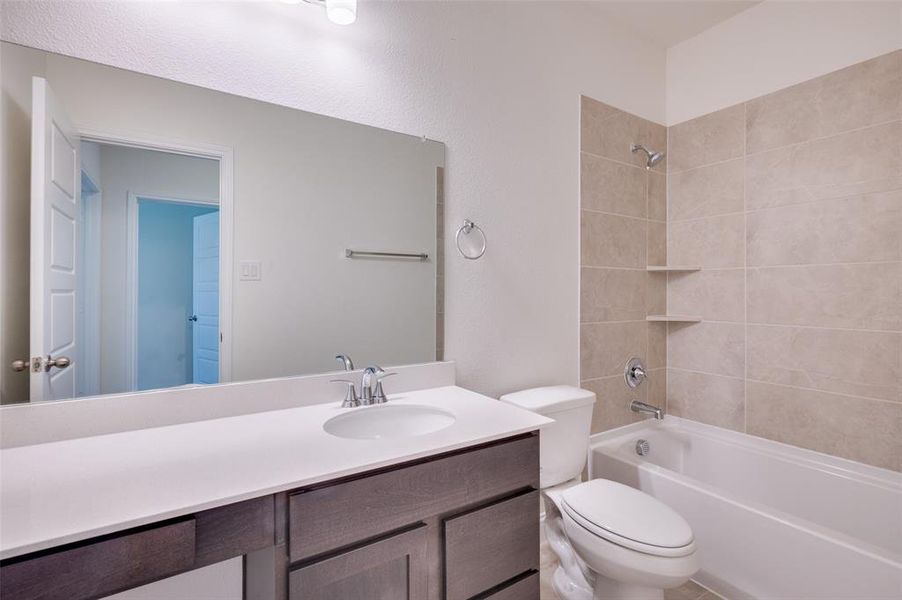 Full bath with bathing tub / shower combination and vanity