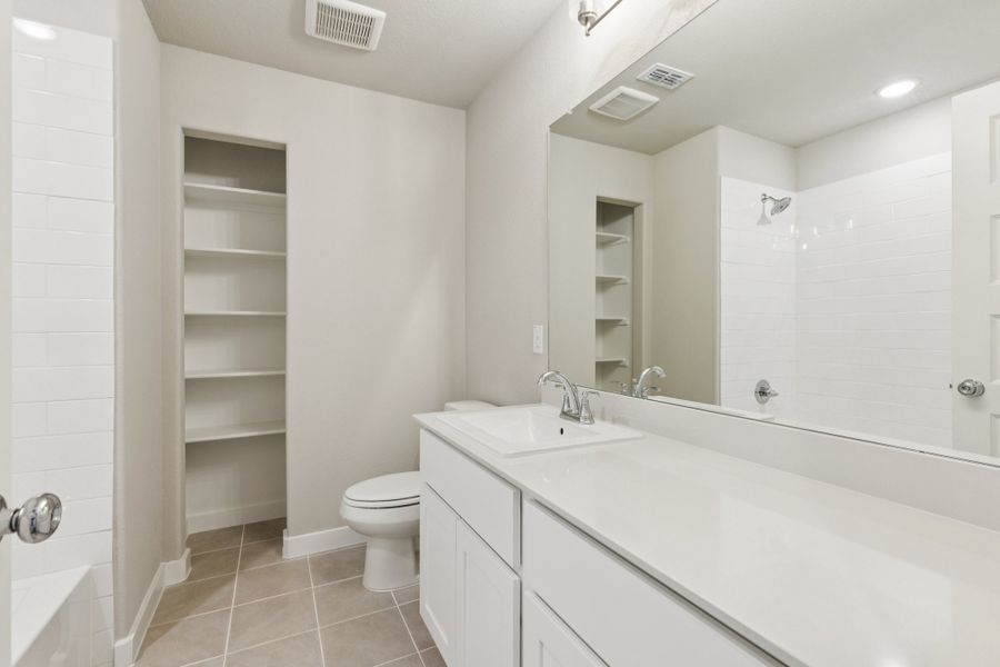 Bathroom in the Stanley II home plan by Trophy Signature Homes – REPRESENTATIVE PHOTO