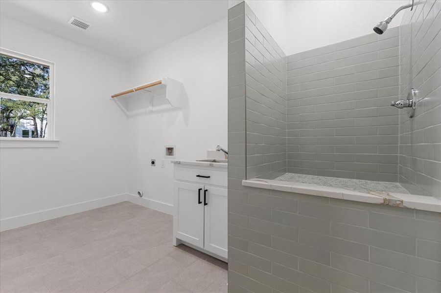 Laundry room with pet wash station