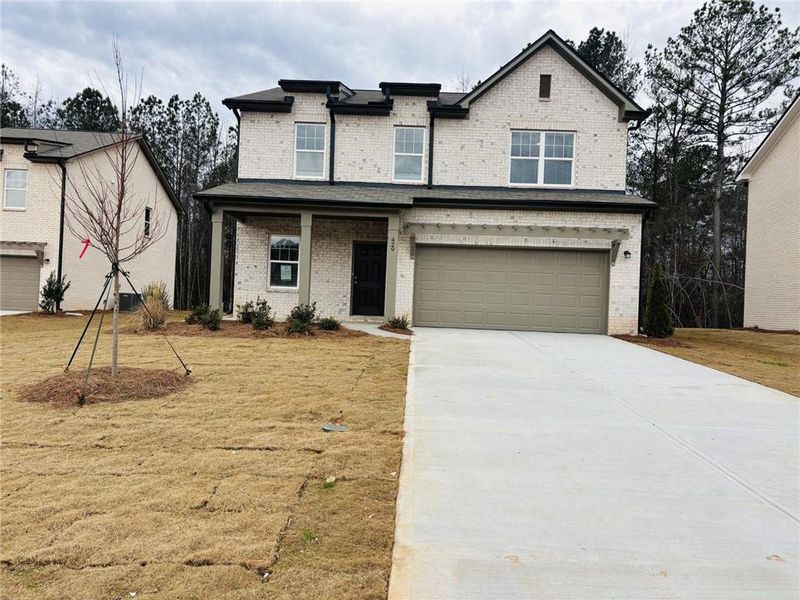 Front exterior of a new home in Kendall Grove, McDonough, GA, highlighting curb appeal (Image 9).