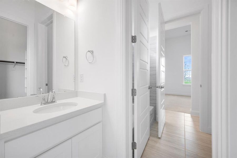 Bathroom with vanity and tile patterned flooring