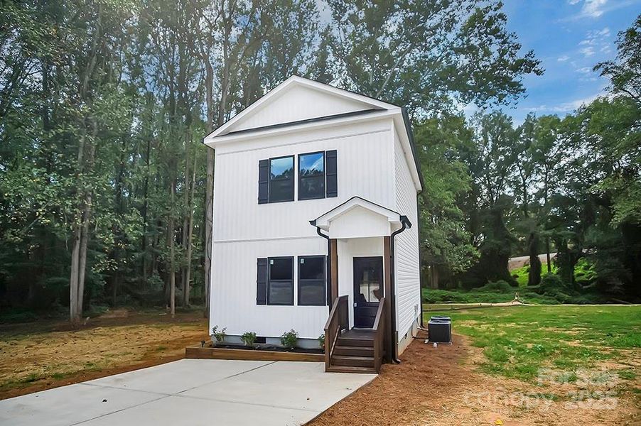 Front exterior of a new home in , Shelby, NC, highlighting curb appeal (Image 25).