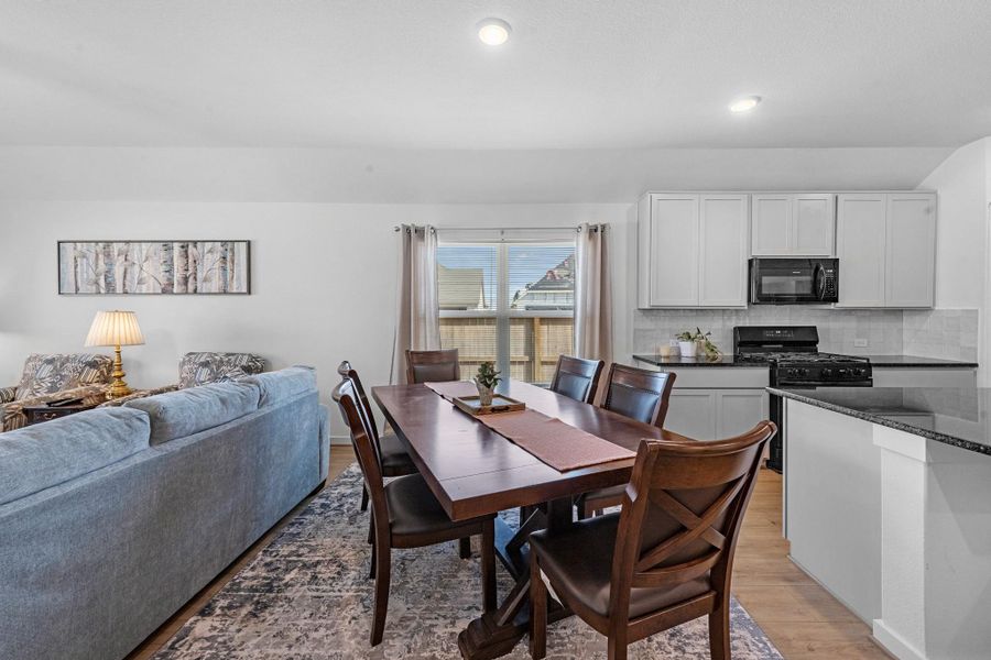 The dining area is a perfect blend of style and functionality, providing an inviting space for memorable meals and gatherings.