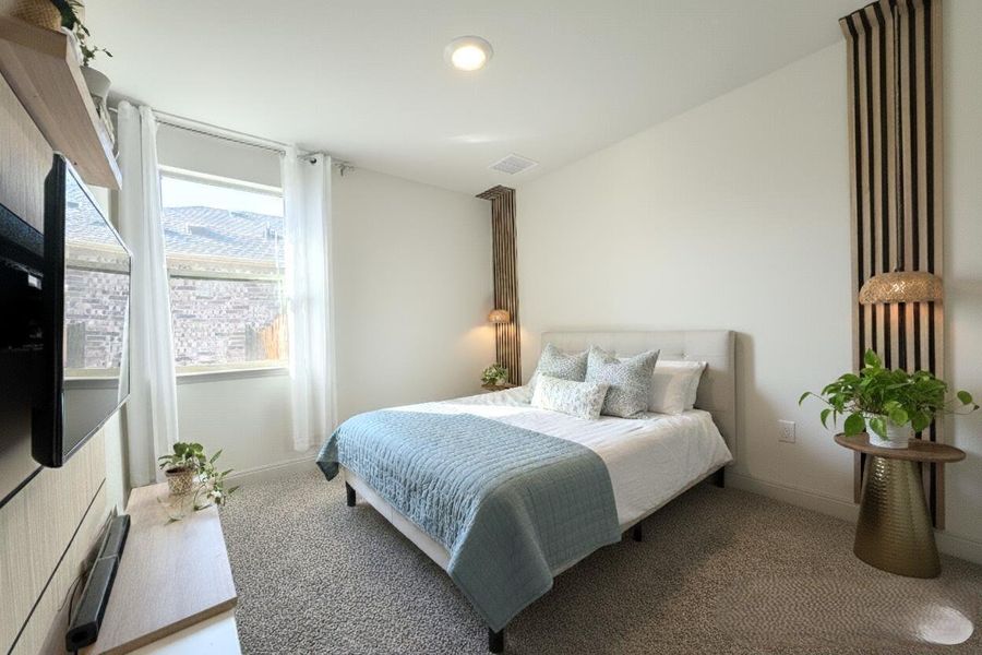Carpeted bedroom featuring baseboards and recessed lighting