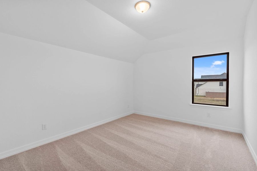 An inviting secondary bedroom that balances refined finishes with everyday livability with plush carpet and a well placed window. An inviting secondary bedroom that balances refined finishes with everyday livability with plush carpet and a well placed window.