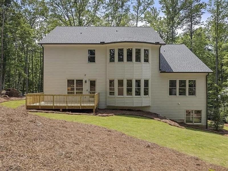 Front exterior of a new home in , Woodstock, GA, highlighting curb appeal (Image 28).