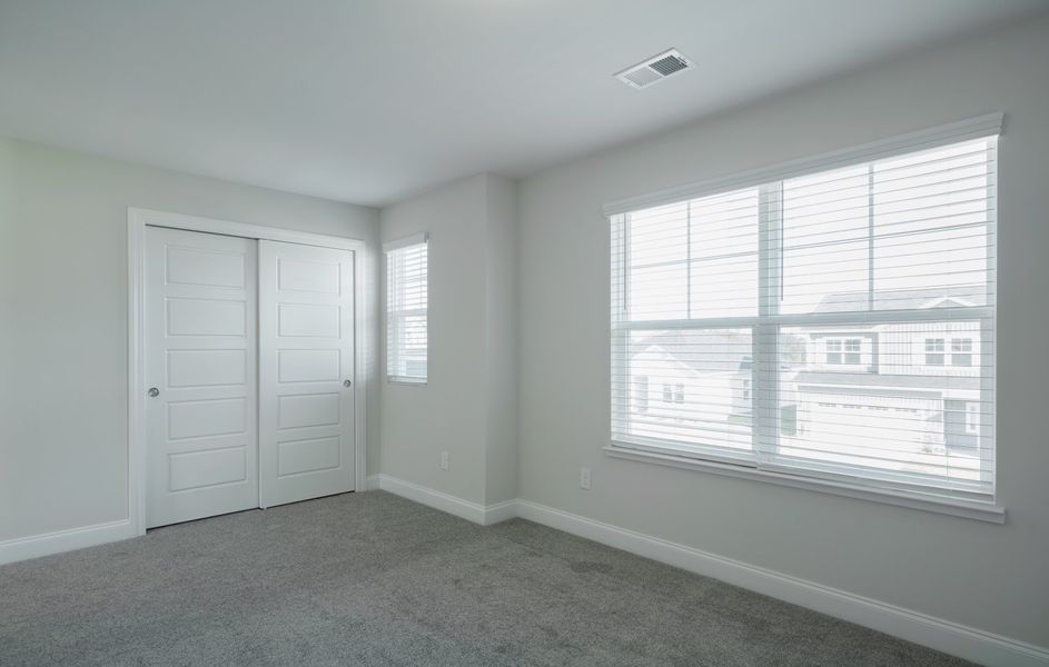 Representative unfurnished interior of a home built from the The Calle by Cothran Homes in Holly Ridge, Greenville (Image 34). Representative unfurnished interior of a home built from the The Calle by Cothran Homes in Holly Ridge, Greenville (Image 34).