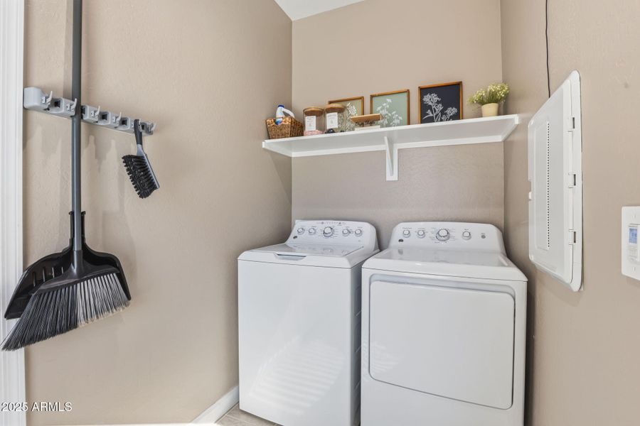Washer and dryer next to garage