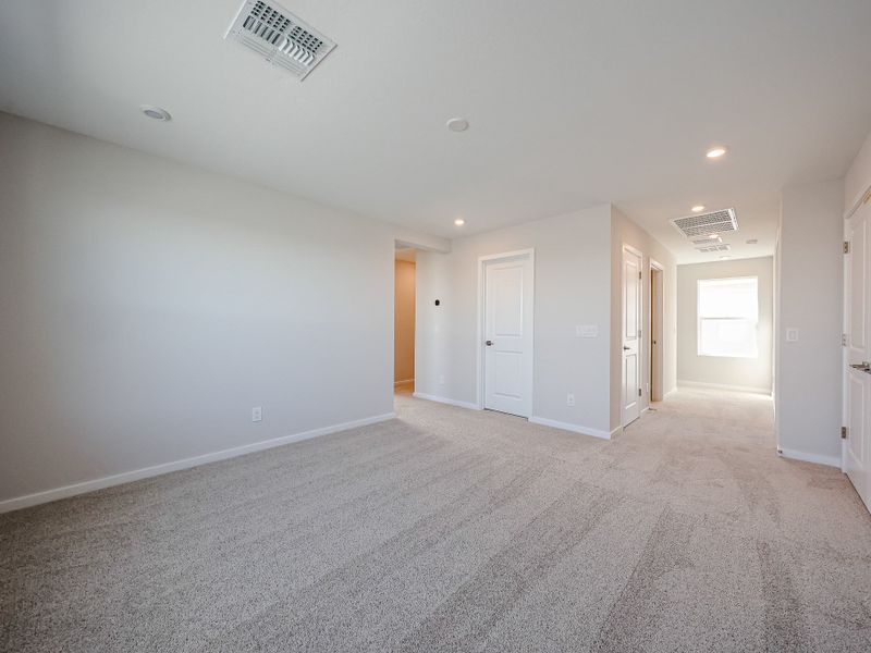 A long hallway with white doors. A long hallway with white doors.