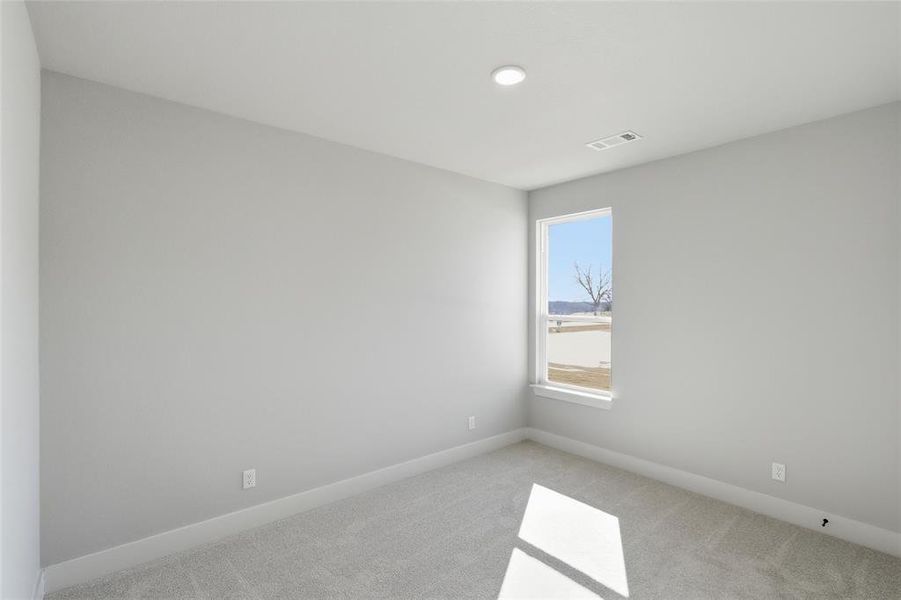 Unfurnished room featuring carpet flooring and baseboards