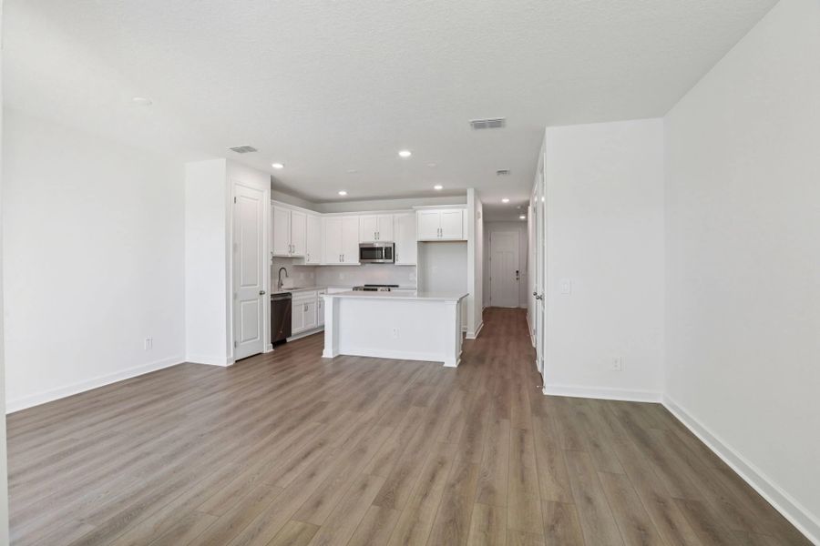 Open concept plan allows for seamless transition between kitchen, living and dining spaces