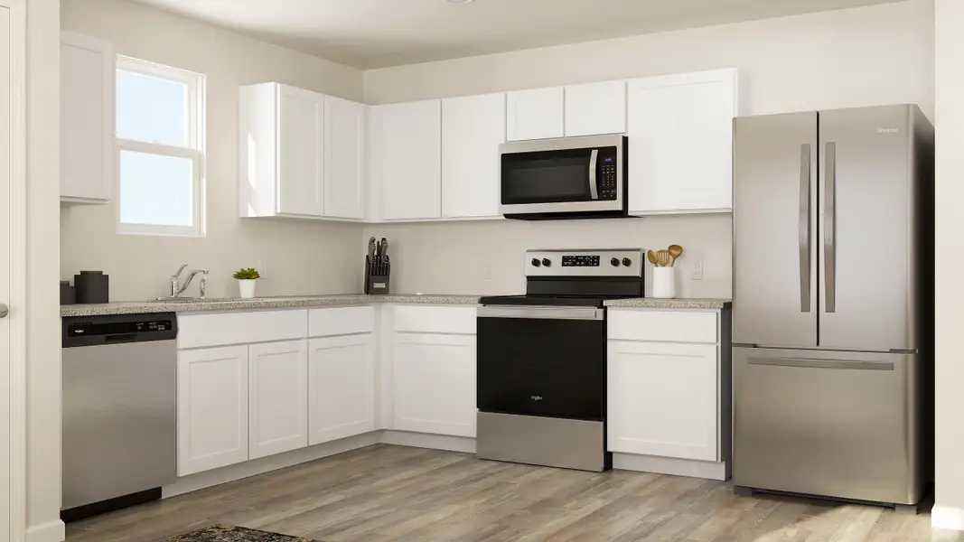 A kitchen with white cabinets. A kitchen with white cabinets.