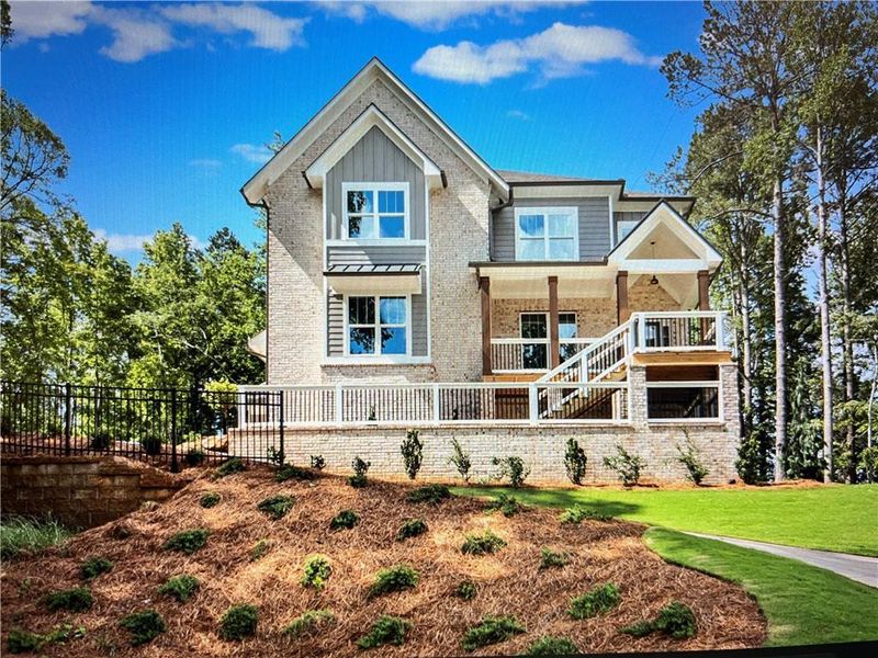 Front exterior of a new home in Liberty Springs, Woodstock, GA, highlighting curb appeal (Image 2). Front exterior of a new home in Liberty Springs, Woodstock, GA, highlighting curb appeal (Image 2).