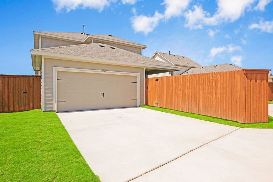 Representative exterior photo of a completed home built from the Lockhart by Impression Homes in Heartland, Heartland, TX (Image 28).