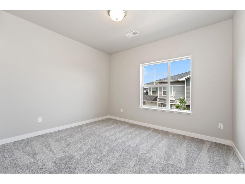 Spacious, unfurnished interior of a new home in The Lakes at Centerra, Loveland (Image 22).