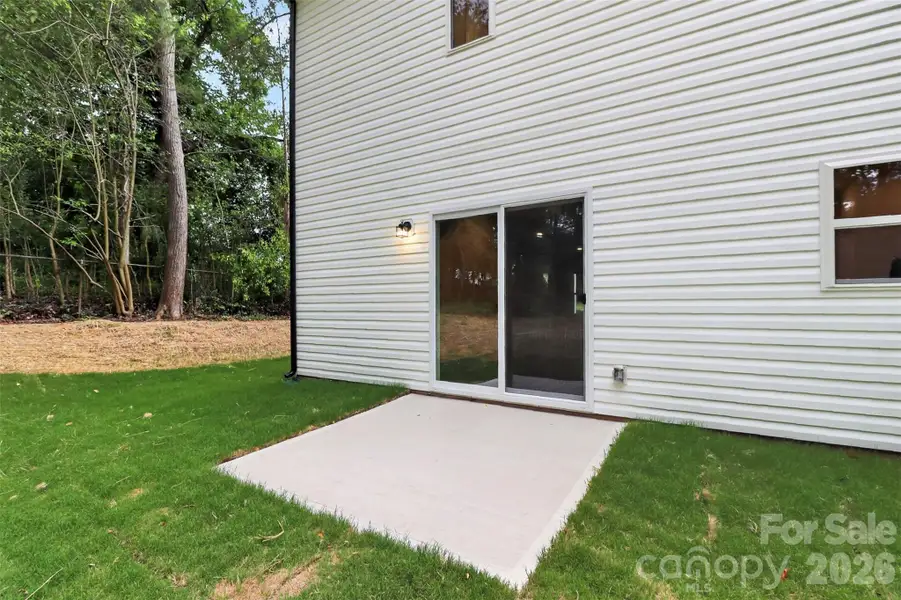 Exterior details and patio area of a home in , Belmont (Image 4).