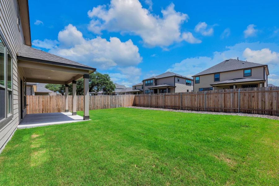 Front exterior of a new home in River Bluff, Leander, TX, highlighting curb appeal (Image 20). Front exterior of a new home in River Bluff, Leander, TX, highlighting curb appeal (Image 20).